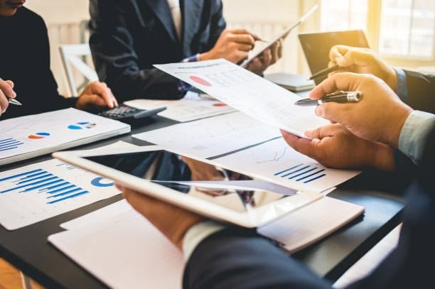 business corporate team brainstorming with chart and checking and analysis
